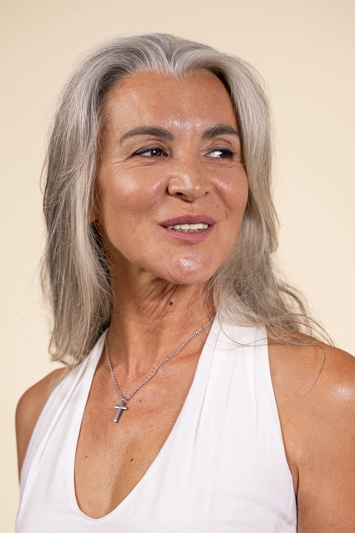 Woman wearing the silver Cross of Hope necklace