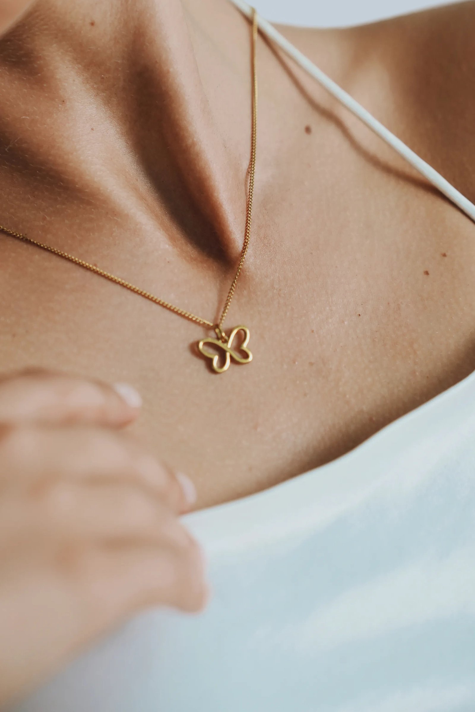 Collier papillon infini