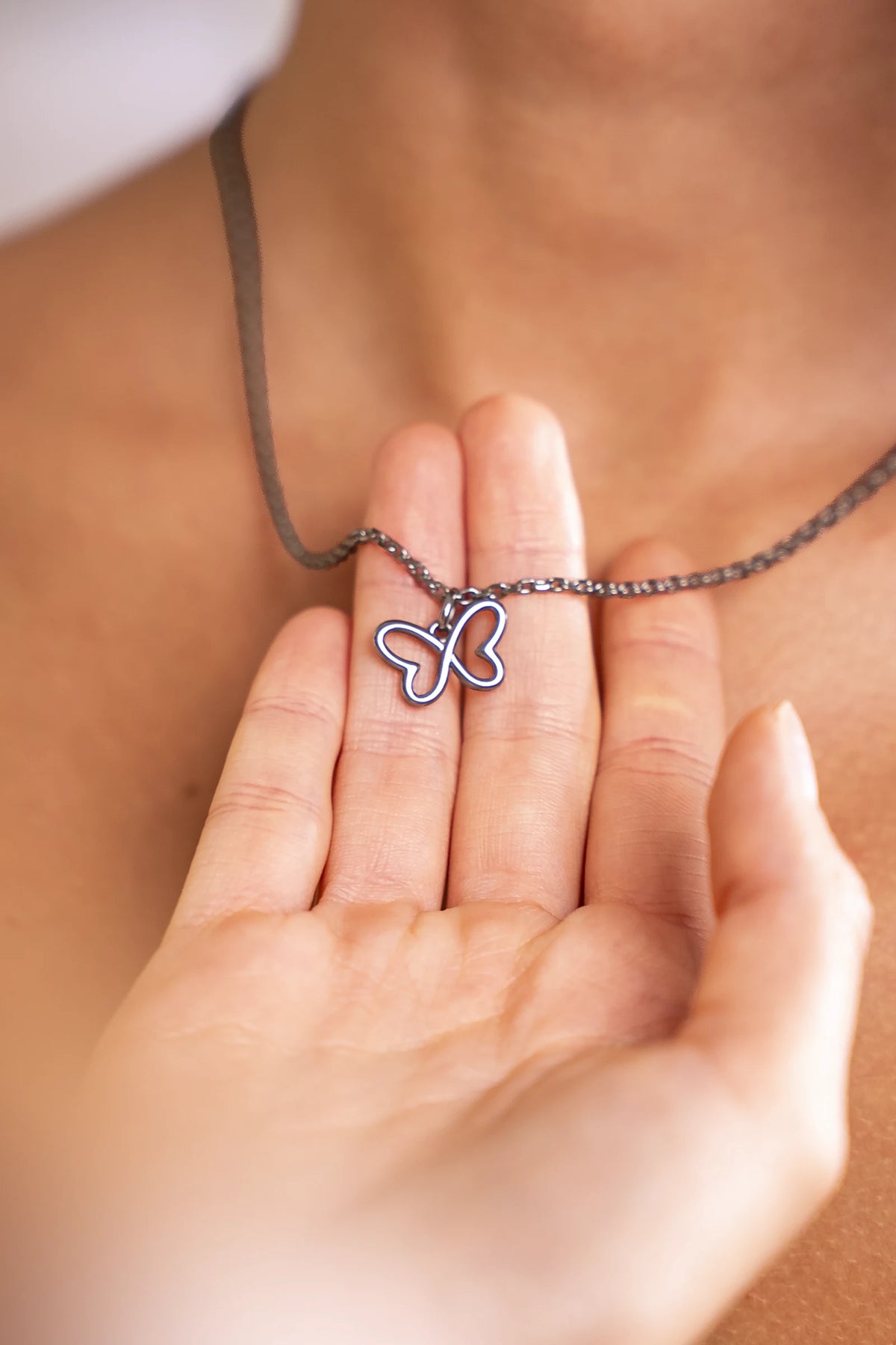 Silver Infinity Butterfly necklace pendant detail