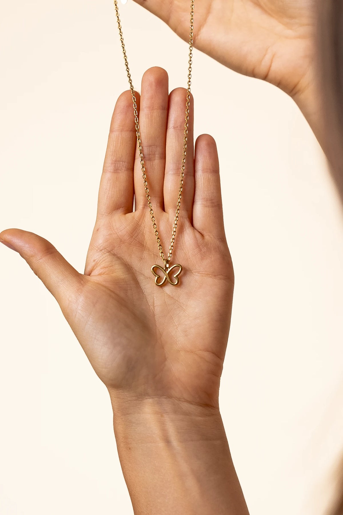 Gold Infinity Butterfly necklace pendant detail