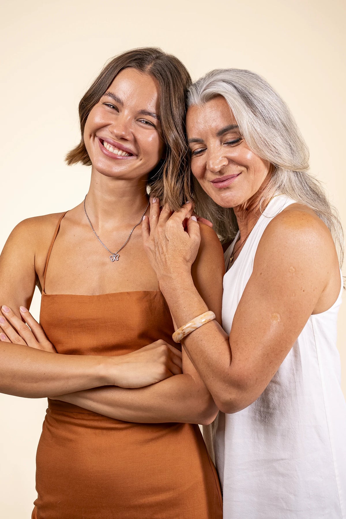 Woman wearing the silver Infinity Butterfly necklace
